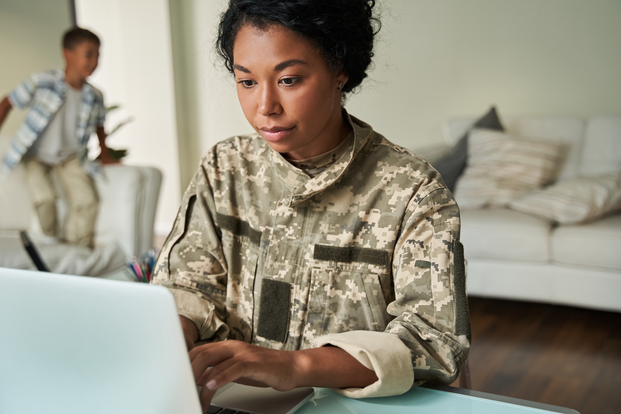 Military women on laptop.